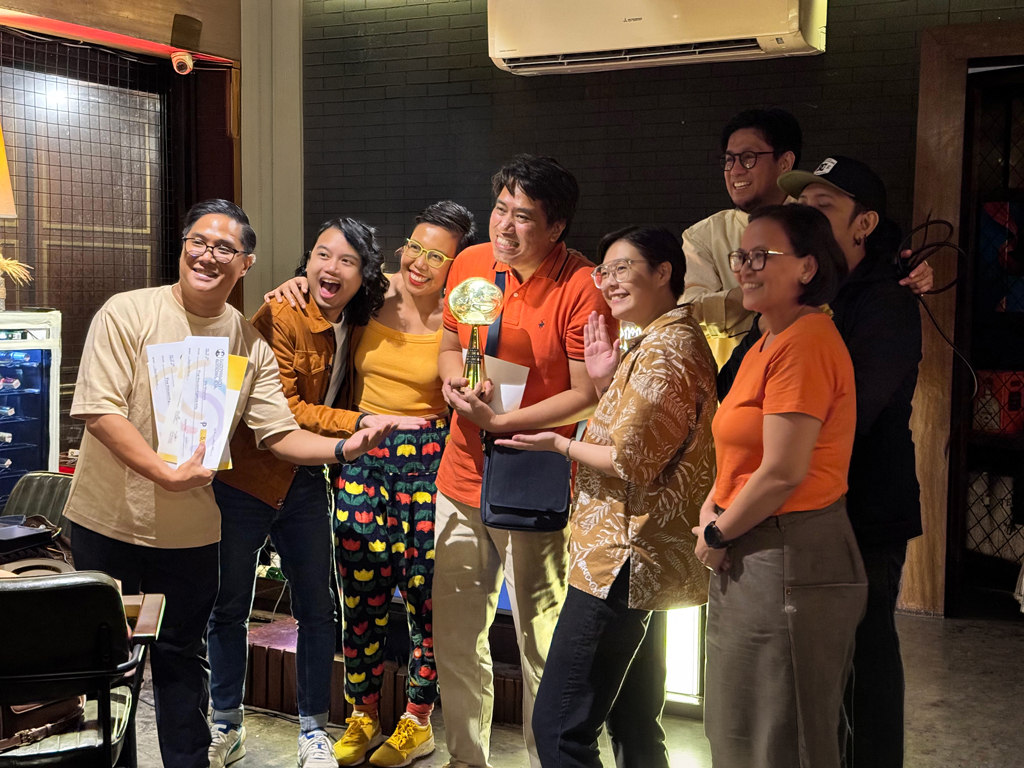 group celebrates award win event